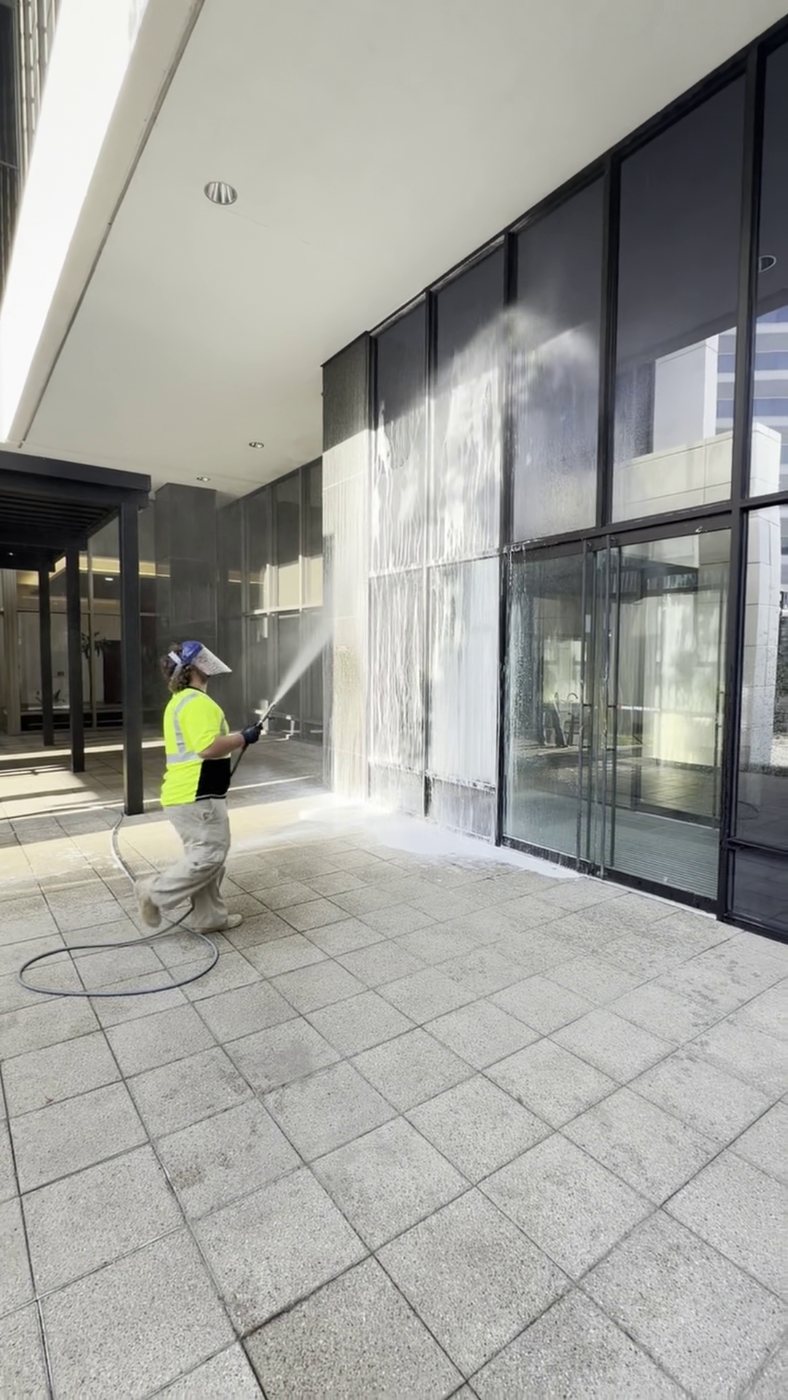 Soft washing a glass storefront